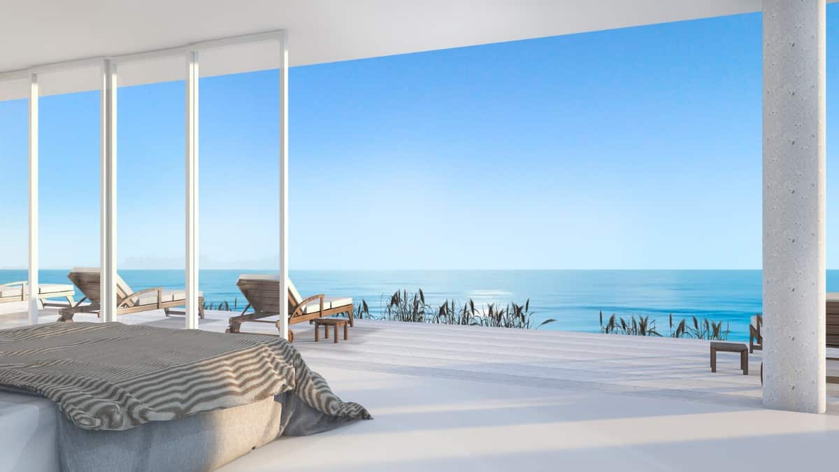 A beautiful blue ocean view from a modern bedroom in a luxury resort